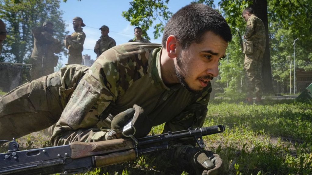 Newly recruited soldiers of the 3rd assault brigade train in Kyiv, Ukraine, Friday, May 17, 2024