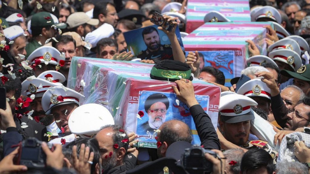 In this photo released by the Iranian Presidency Office, flag-draped coffins of the President Ebrahim Raisi and his companions who were killed in a helicopter crash on Sunday.