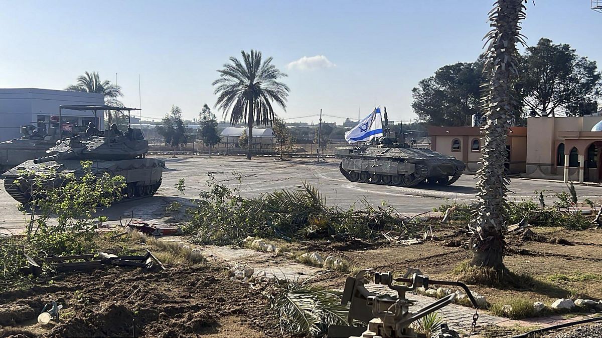 A photo provided by the Israel Defense Forces shows a tank with an Israel flag on it entering the Gazan side of the Rafah border crossing on Tuesday, May 7, 2024.