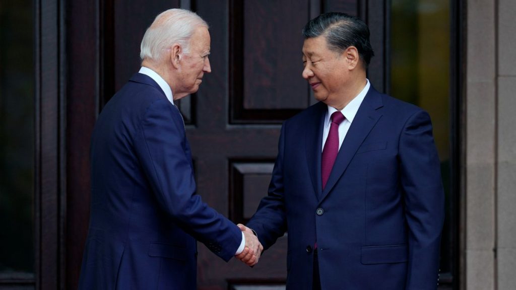 US President Joe Biden, left, greets China