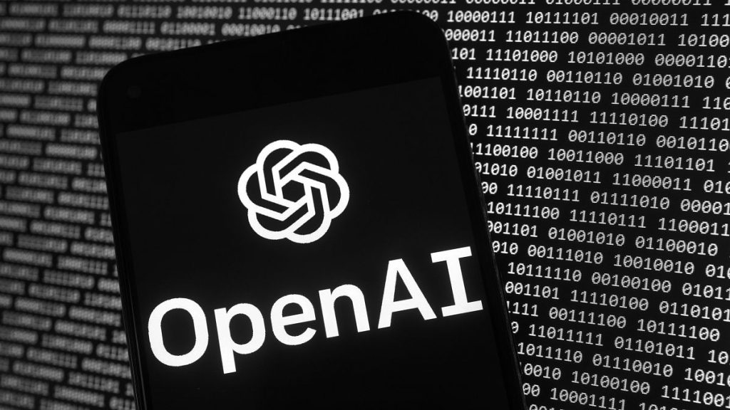 The OpenAI logo appears on a mobile phone in front of a computer screen with random binary data, Thursday, March 9, 2023, in Boston.