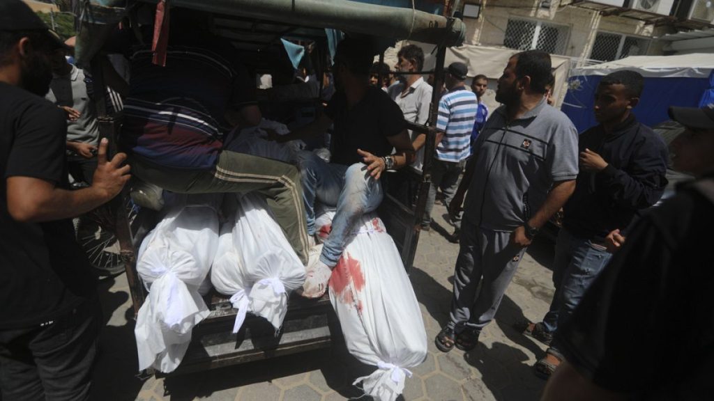 Palestinians killed in the Israeli bombardment of the Gaza Strip are brought to al-Aqsa Hospital in Deir al-Balah, central Gaza Strip, Saturday, June 8, 2024.