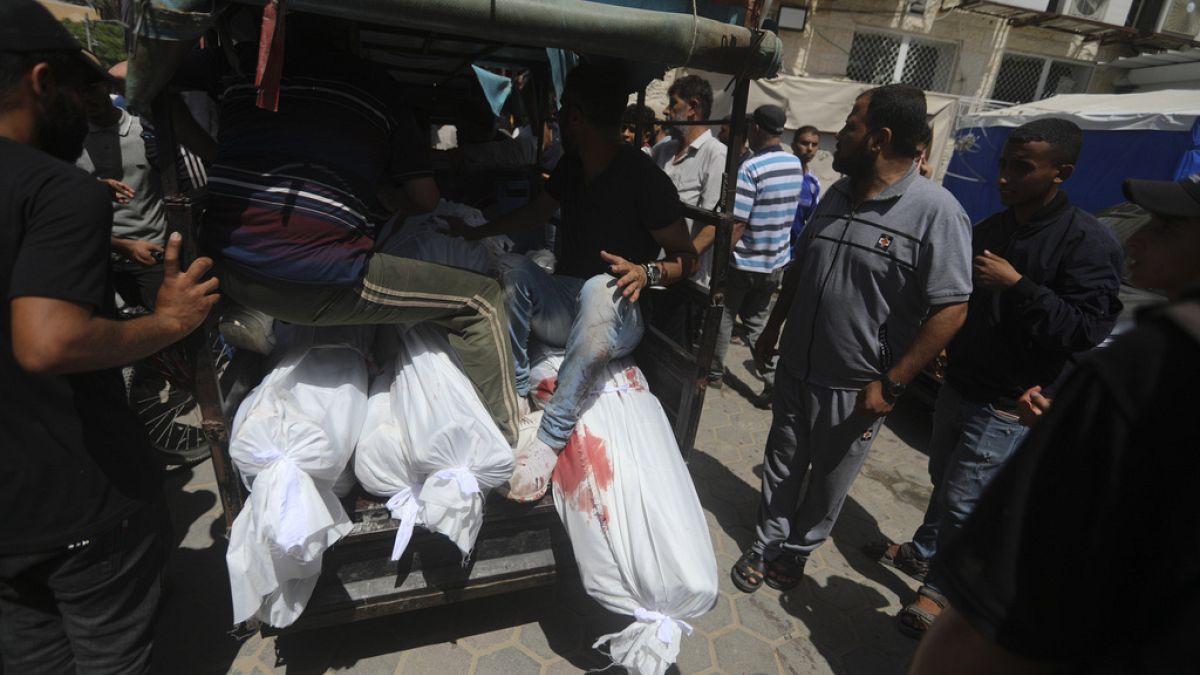 Palestinians killed in the Israeli bombardment of the Gaza Strip are brought to al-Aqsa Hospital in Deir al-Balah, central Gaza Strip, Saturday, June 8, 2024.