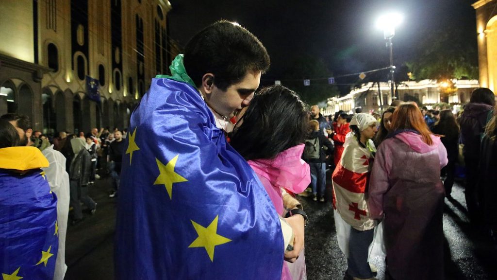 A man and a woman participate in a protest against the so-called