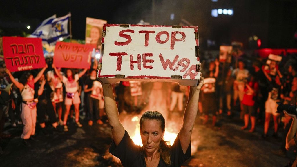 People protest in Tel Aviv against Israeli Prime Minister Benjamin Netanyahu
