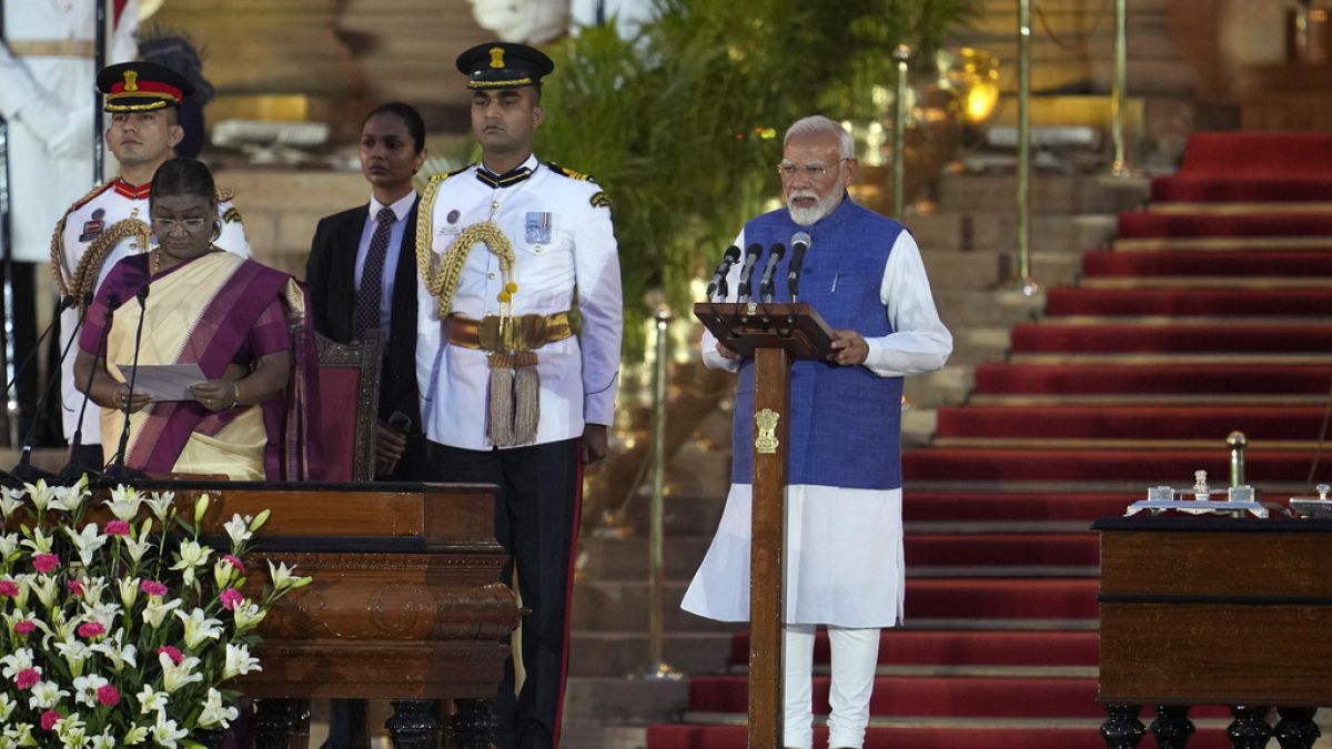 Narendra Modi, right, is sworn-in as the Prime Minister of India by President Droupadi Murmu, left, at the Rashtrapati Bhawan, in New Delhi, India, Sunday, June 9, 2024.