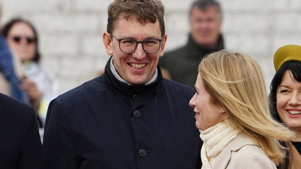Estonian Prime Minister Kaja Kallas, walks past Minister of Climate Kristen Michal in Tallinn, Estonia, on May 2, 2023 (AP Photo/Pavel Golovkin)