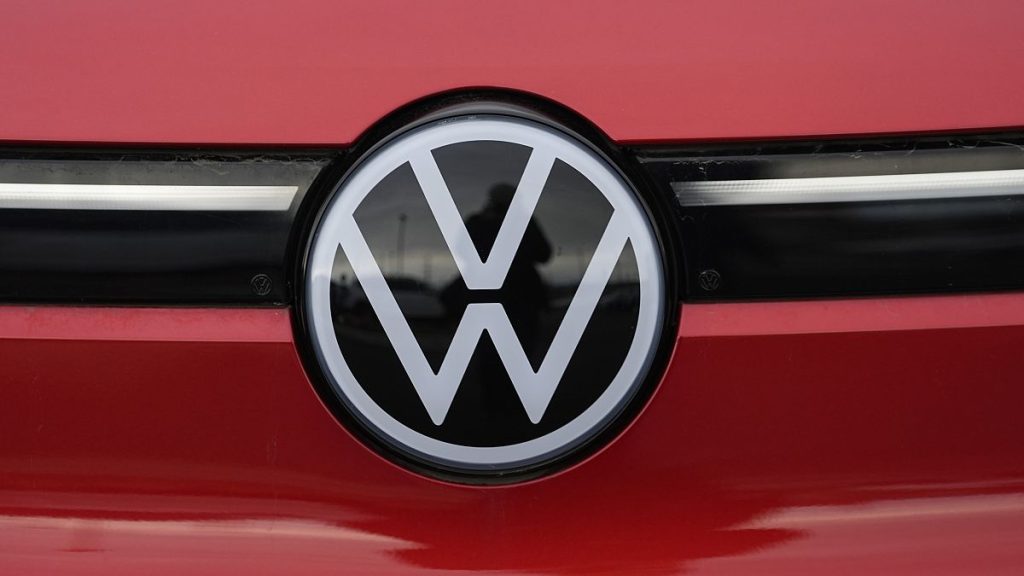 The company logo shines off the grille of an unsold 2023 electric ID.4 sports-utility vehicle at a Volkswagen dealership Sunday, March 17, 2024, in Denver.