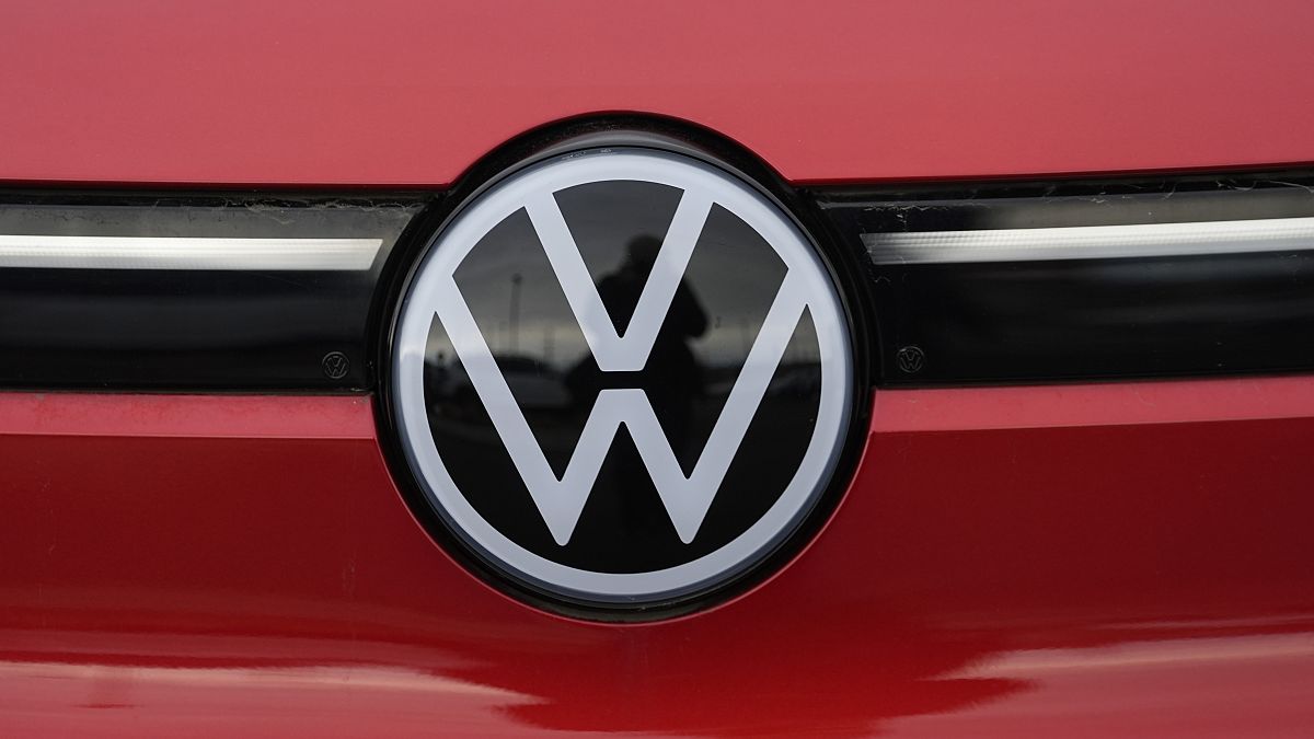 The company logo shines off the grille of an unsold 2023 electric ID.4 sports-utility vehicle at a Volkswagen dealership Sunday, March 17, 2024, in Denver.