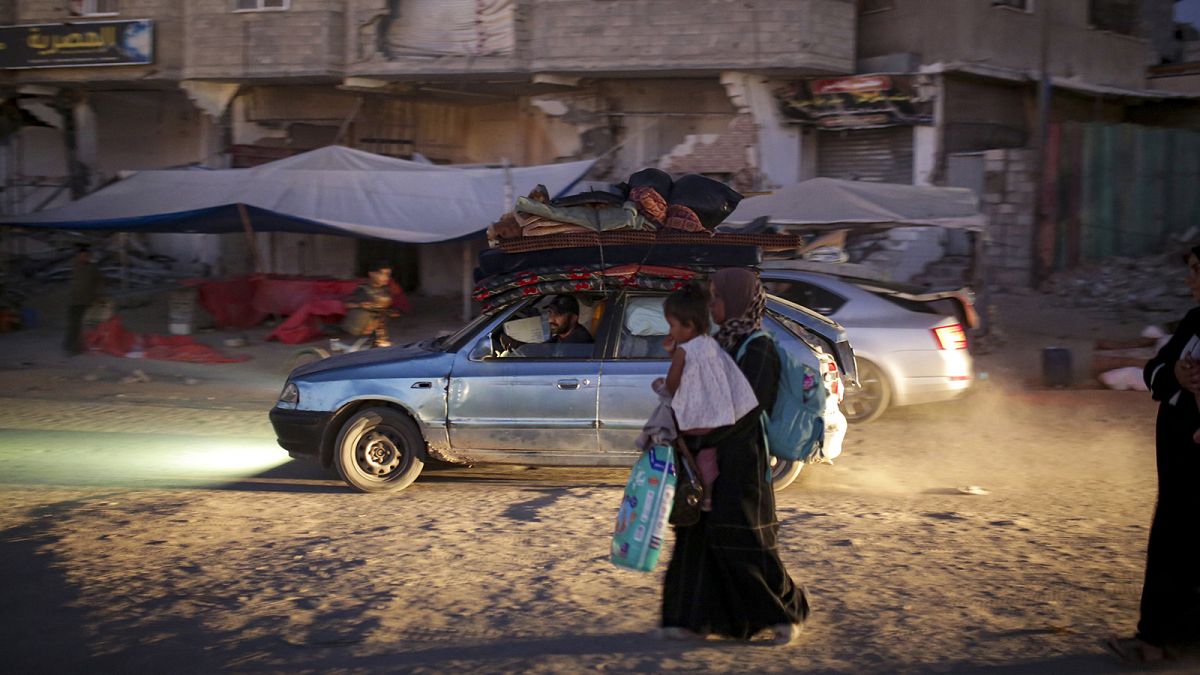 Palestinians displaced by the Israeli air and ground offensive on the Gaza Strip flee from parts of Khan Younis, 1 July 2024.