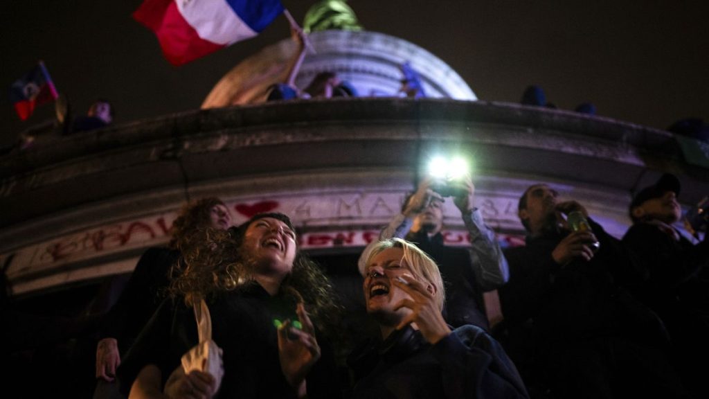 People gather at the Republique plaza after the second round of the legislative election, Sunday, July 7, 2024, in Paris.