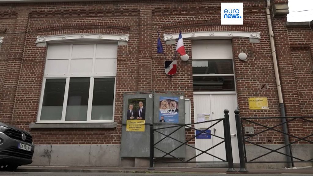 Campaign posters for LREM candidate Gérald Darmanin and RN candidate Bastien Verbrugghe in the tenth constituency of Nord, Tourcoing, on 3 July 2024.
