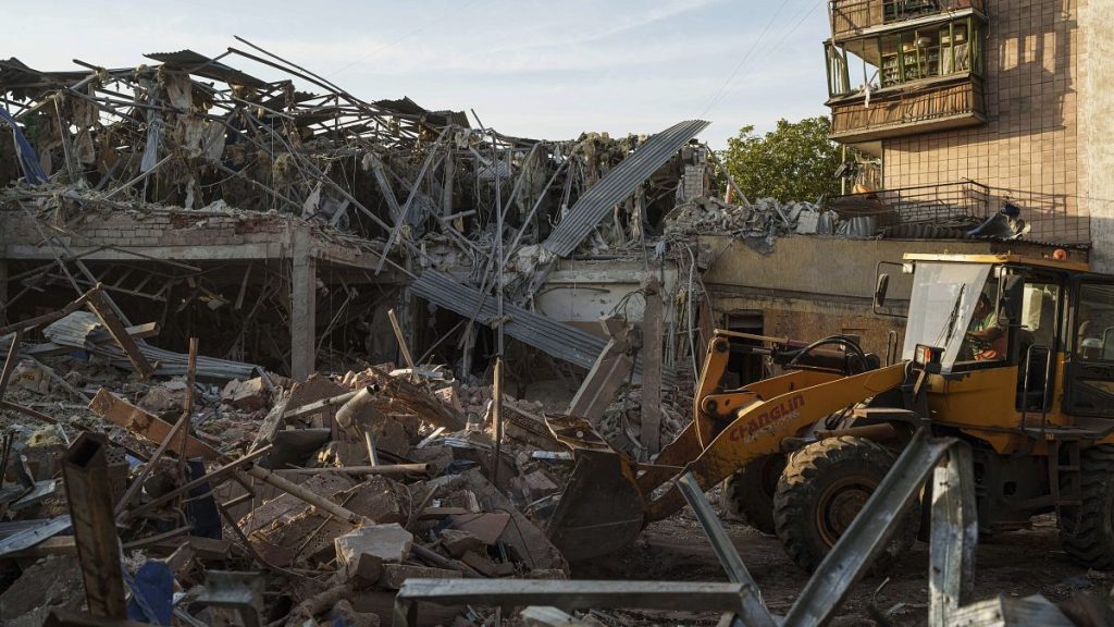A tractor clears the rubble after a Russian strike on the Sapphire hotel in Kramatorsk, Donetsk region, Ukraine, on Sunday, Aug. 25, 2024