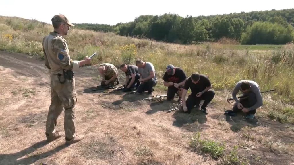 Ukrainians undergo military training in Kharkiv.