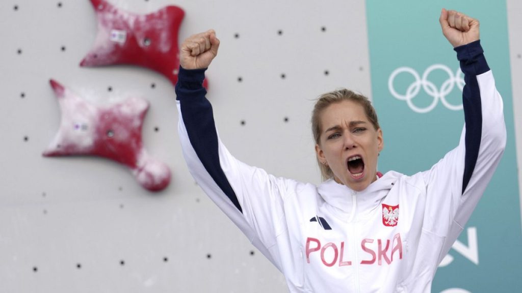 Gold medallist Aleksandra Miroslaw of Poland celebrates on the podium after winning the women