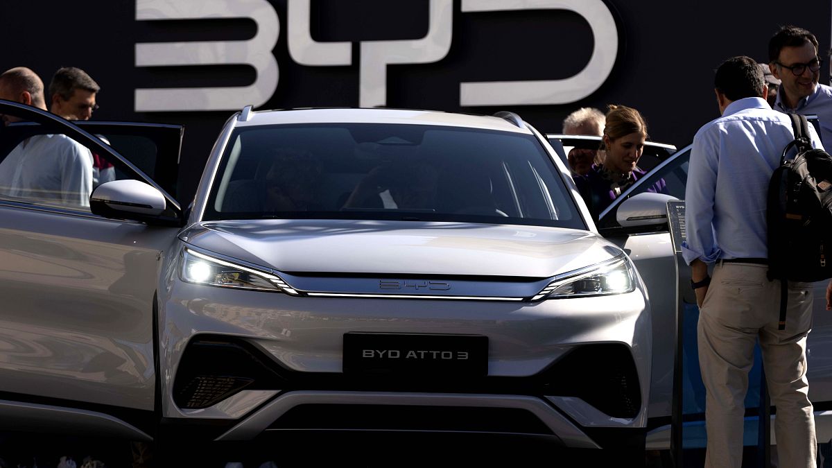 FILE - Visitors look at the Chinese made BYD ATTO 3 at the IAA motor show in Munich, Germany, on Sept. 8, 2023.