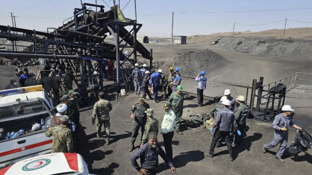 Miners and police officers at coal mine where methane leak sparked an explosion on Saturday, in Tabas, some 540 kilometres southeast of Tehran, Iran