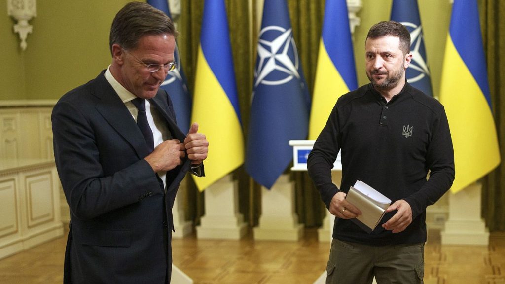 NATO Secretary General Mark Rutte, left, and Ukrainian President Volodymyr Zelenskyy leave the hall after a joint press conference in Kyiv, October 3, 2024