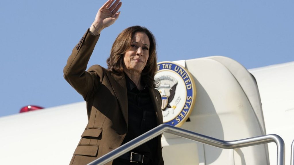 Democratic presidential nominee Vice President Kamala Harris waves as she boards Air Force Two, Friday, Oct. 11, 2024,