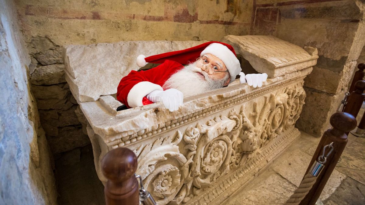 An ancient sarcophagus in St. Nicholas Church, Demre (feat. modern-day Santa, who was inspired by Saint Nicholas).