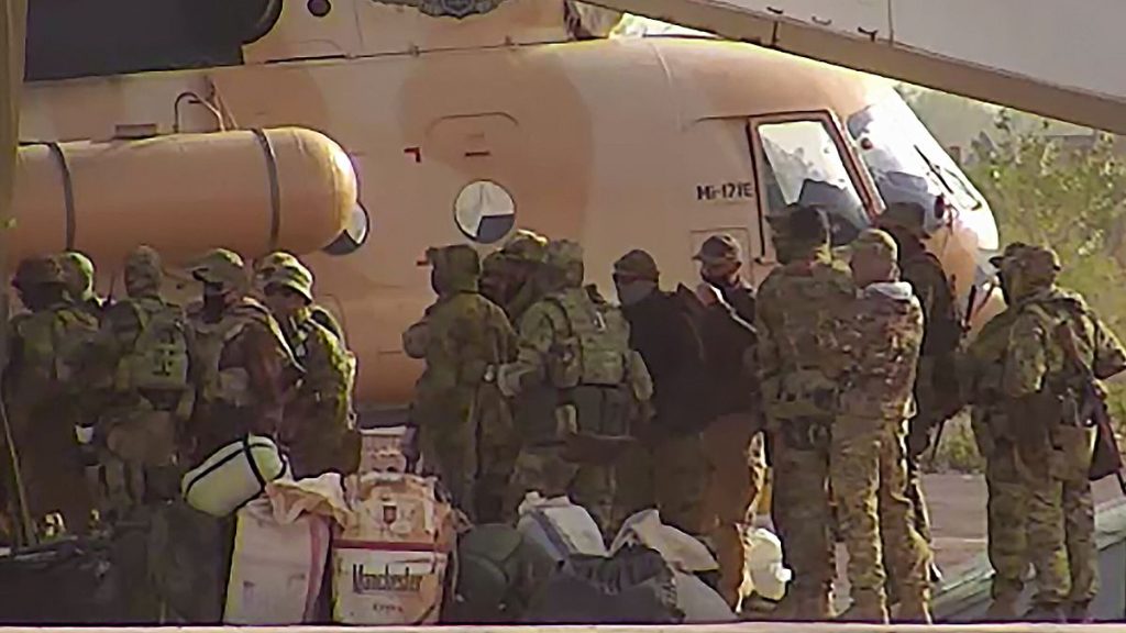 Russian mercenaries board a helicopter in northern Mali in a photo released by the French army in April 2022.