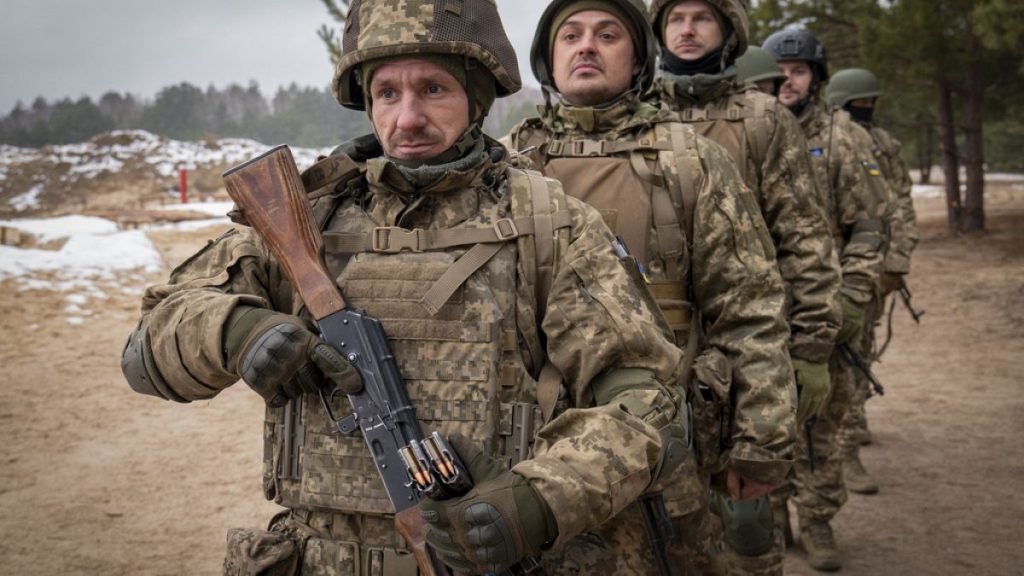New recruits practice on a military training ground in Chernihiv region, Ukraine, Thursday, Dec. 5, 2024.