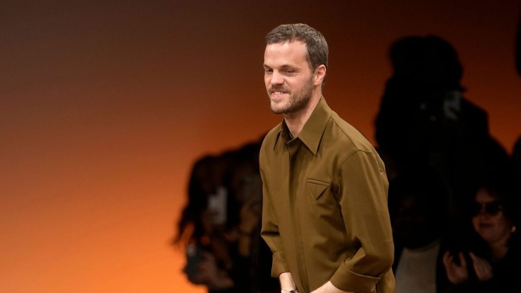 Matthieu Blazy accepts applause after the conclusion of the Bottega Veneta women