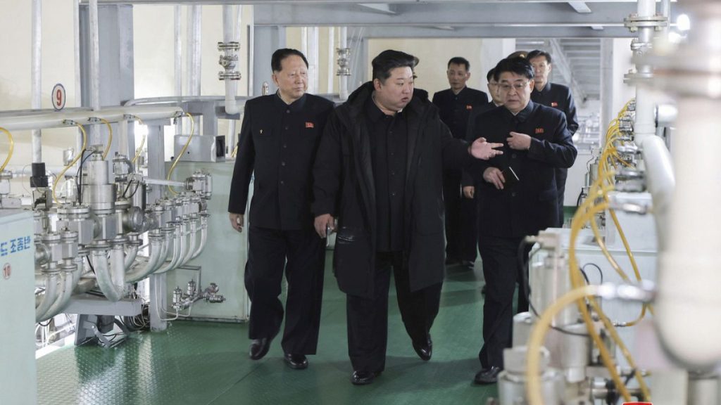 In this undated photo provided Wednesday, Jan. 29, 2025, by the North Korean government, Kim Jong Un, second right, inspects a facility that produces nuclear material