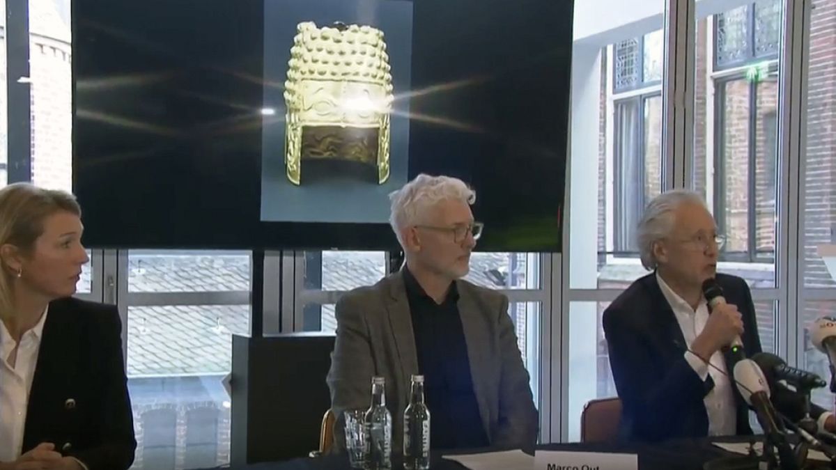 Drents Museum director Harry Tupan speaks at a press conference before an image of the Cotofenesti helmet in Assen, Netherlands.
