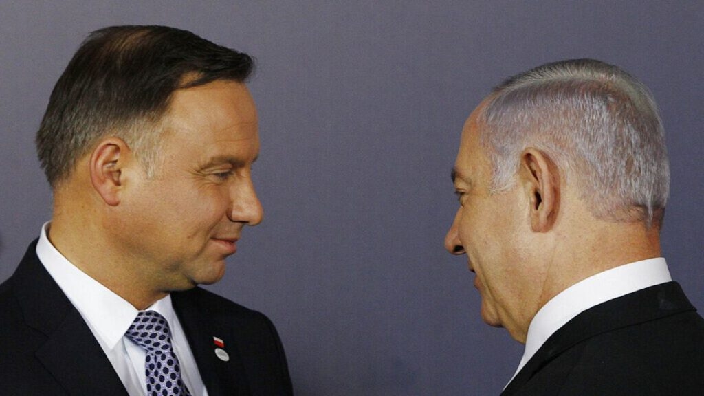 FILE: Polish President Andrzej Duda, left, and Israeli Prime Minister Benjamin Netanyahu, talk during a conference in Warsaw, Poland, Feb. 13, 2019