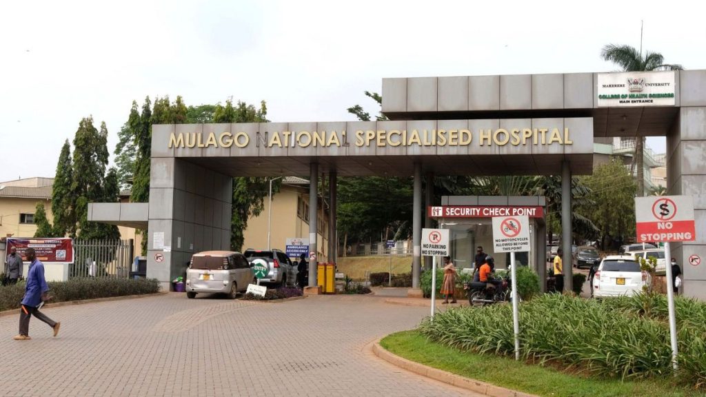 People walk outside the Mulago National Hospital in Kampala, Uganda, Thursday, Jan, 30, 2024, where a nurse had died of Ebola.