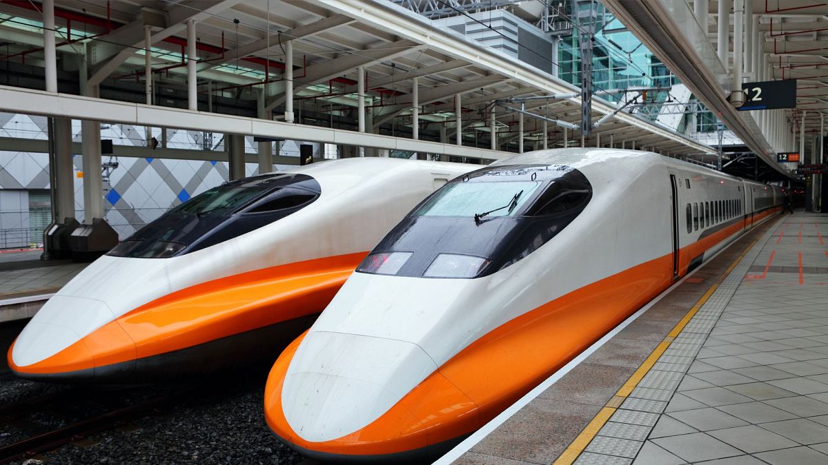 Two modern high-speed trains in a train station