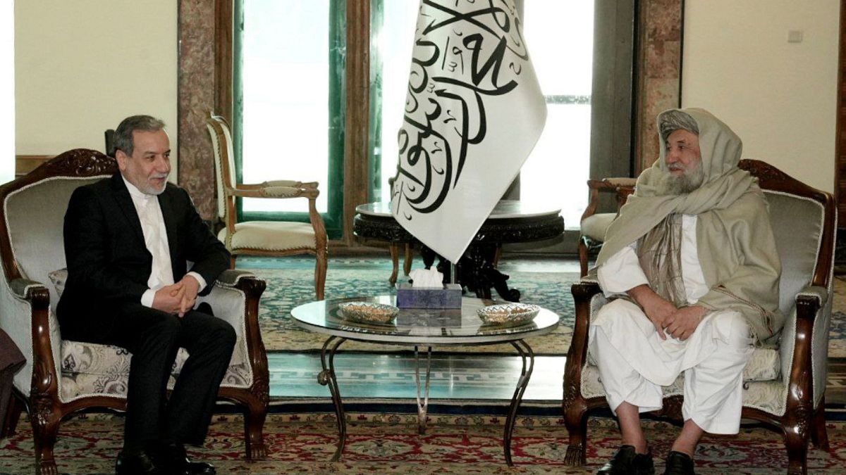 Iranian Foreign Minister Abbas Araghchi, left, meets Afghanistan