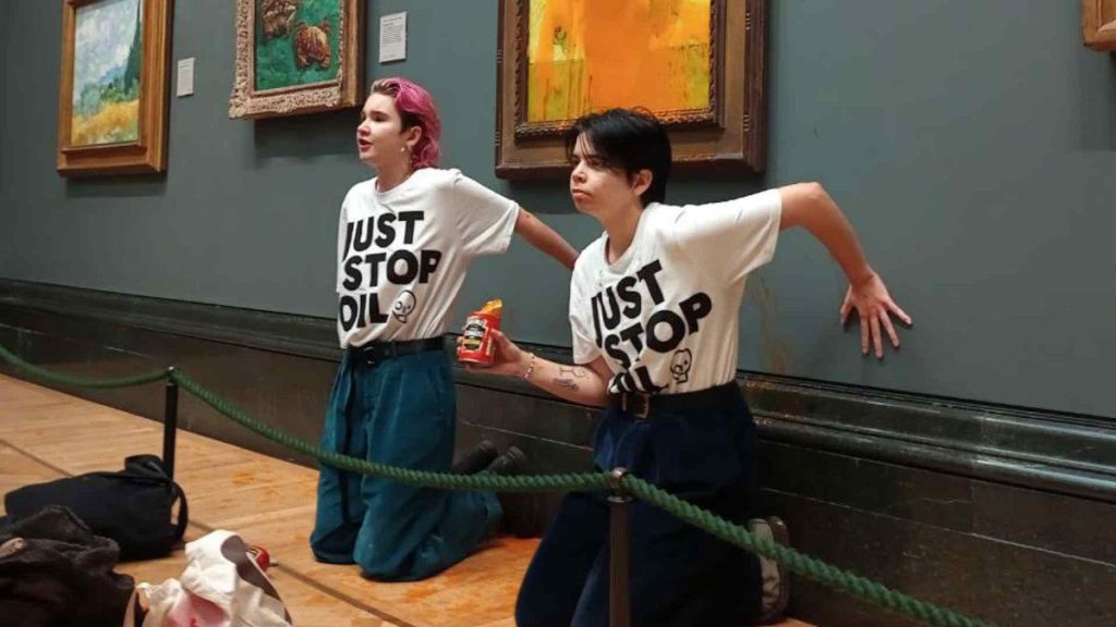 Just Stop Oil protestors after throwing tomato soup onto Van Gogh