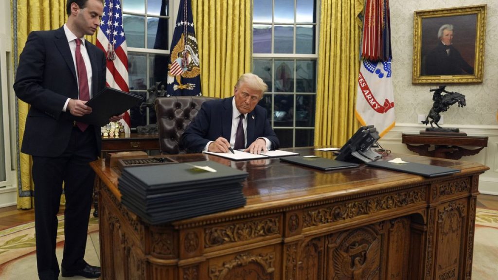 US President Donald Trump signs an executive order withdrawing the US from the WHO in January 2025.