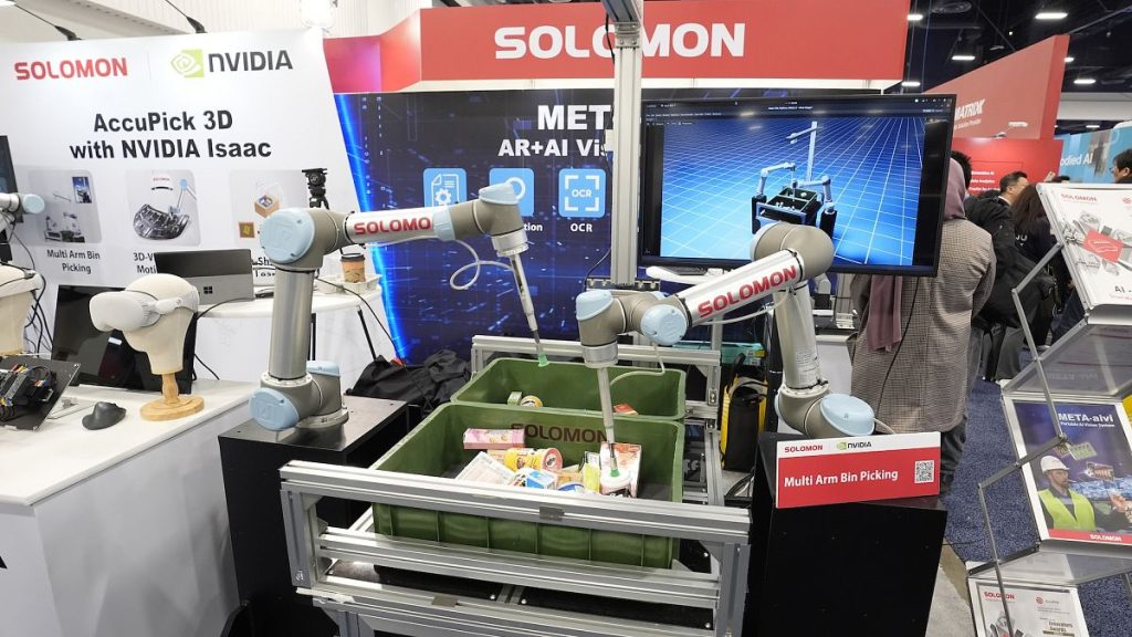 A Solomon Multi Arm Bin Picking machine with Nvidia Isaac robotics is displayed at a Solomon booth during January