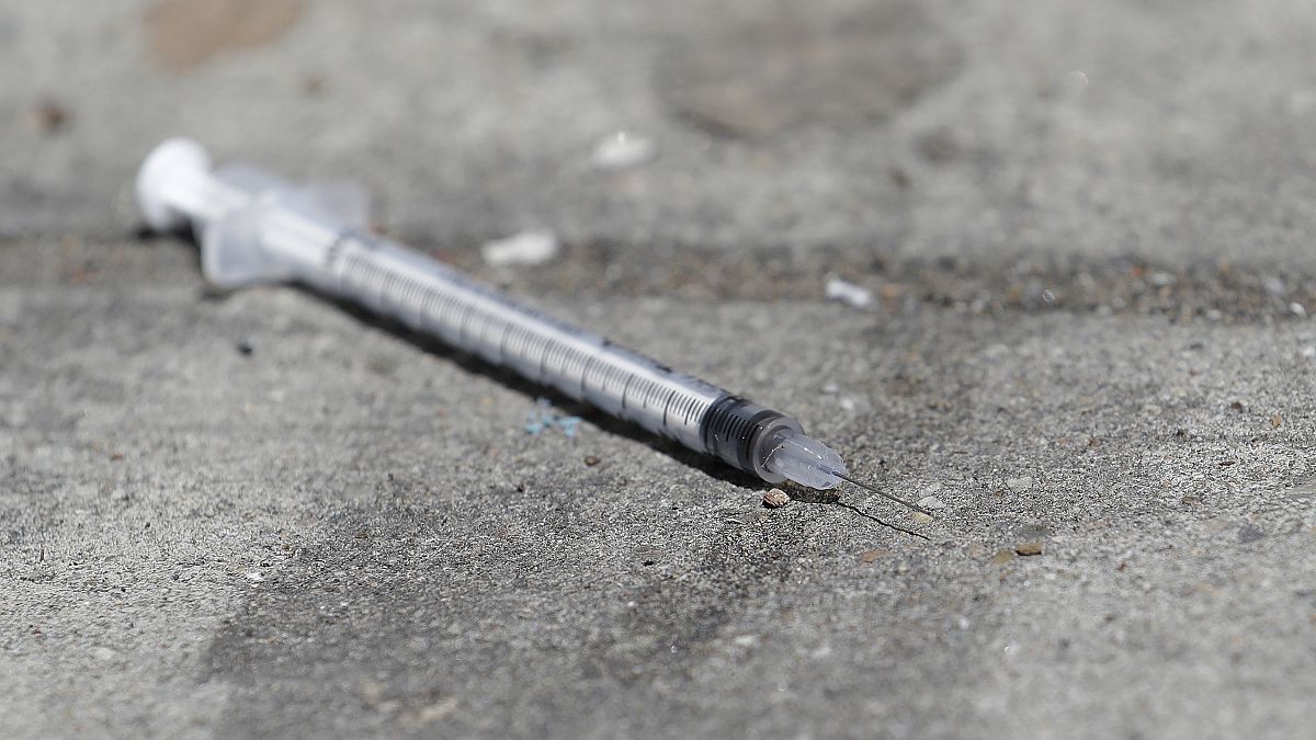 A used syringe is shown on a US sidewalk in this 2018 file photo.
