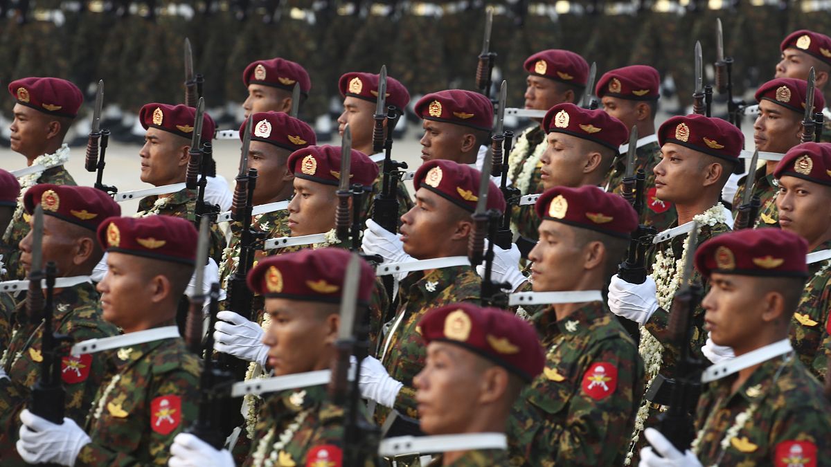 Military officers march during a parade to commemorate Myanmar