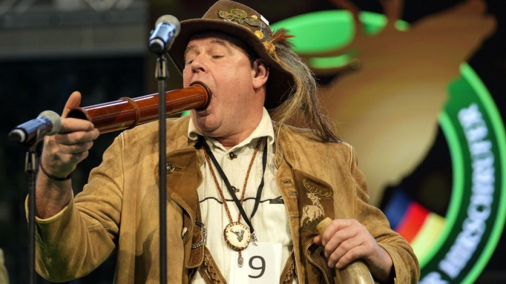 Immo Ortlepp performs to imitate a stag in heat during the German Championship of Deer-Calling