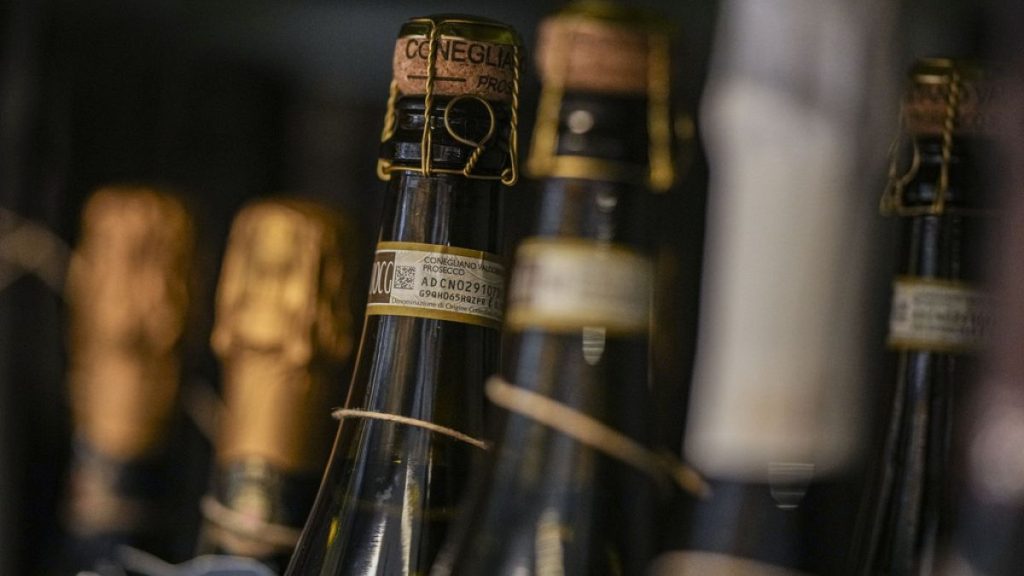 Bottles of Prosecco are lined up on a shelf of a wine shop in Rome, Thursday, Feb. 6, 2025. (AP Photo/Andrew Medichini)
