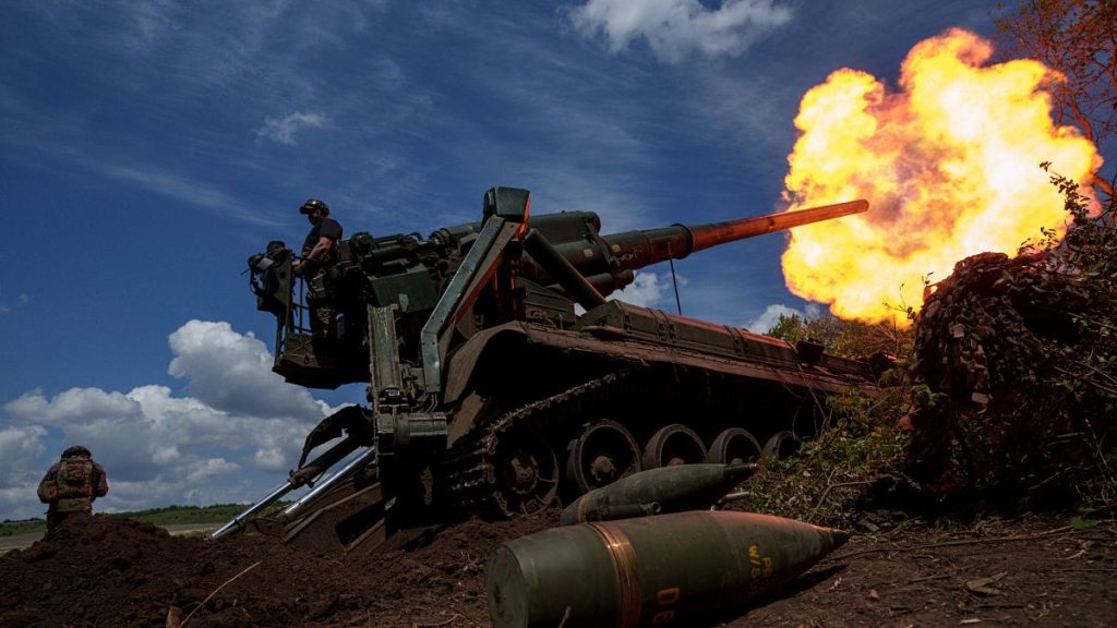 Ukrainian soldiers fire a howitzer toward Russian positions at the front line in eastern Ukraine, 24 June, 2024