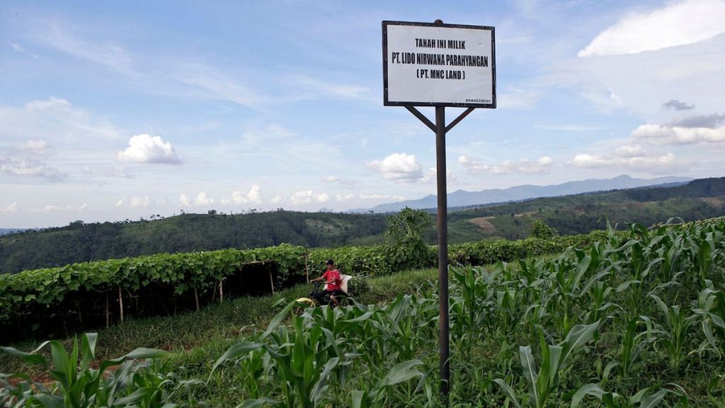 A sign saying the land is owned by MNC Land is put up on a farming field at the planned development site in 8 March 2017.