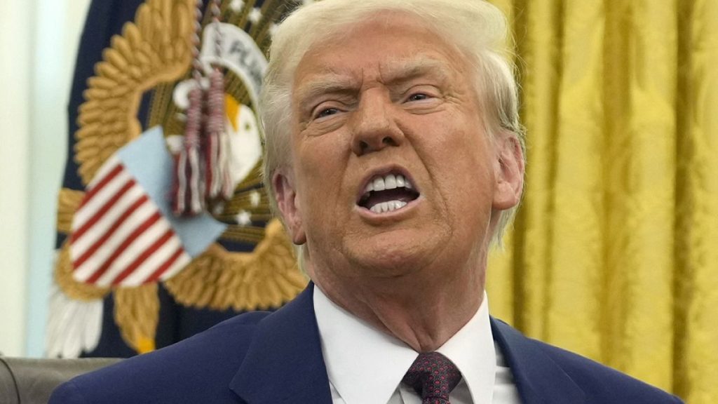 President Donald Trump speaks to reporters after signing an executive order in the Oval Office of the White House, Thursday, Feb. 13, 2025, in Washington