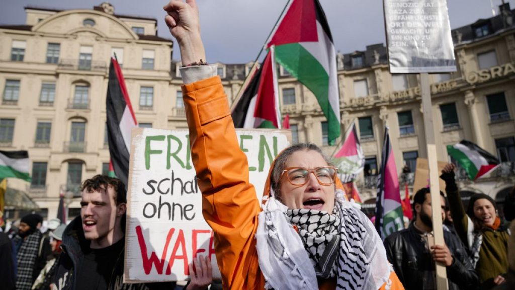 Protestors shout slogan during a protest against the Munich Security Conference in Munich, Saturday, Feb. 15, 2025