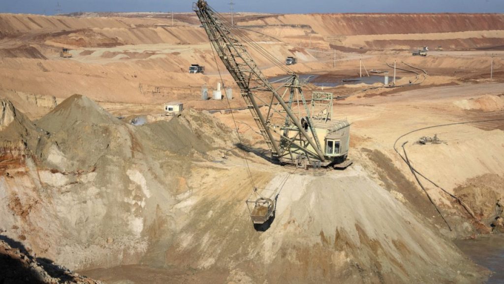 An aerial view of an ilmenite open pit mine in a canyon in the central region of Kirovohrad, Ukraine, Wednesday, Feb. 12, 2025. (AP Photo/Efrem Lukatsky)