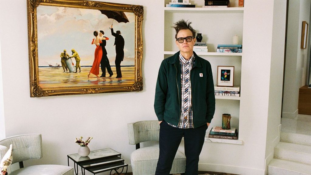 Mark Hoppus of Blink-182 poses by his painting Crude Oil (Vettriano) by Banksy (2005), which is being sold by Sotheby