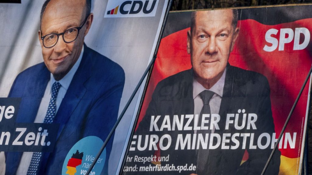 FILE - Election posters showing German Chancellor Olaf Scholz, right, and CDU top candidate for chancellor Friedrich Merz in Frankfurt, Germany, Feb. 8, 2025