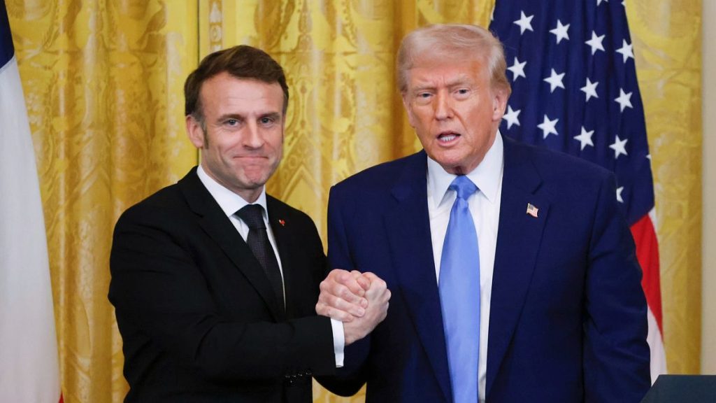 President Donald Trump, right, shakes the hand of France