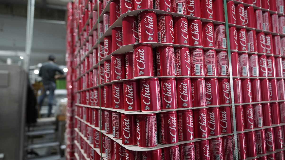 Pallets of branded cans at the production line in the Palestinian Chat Cola bottling plant, in the West Bank city of Salfit