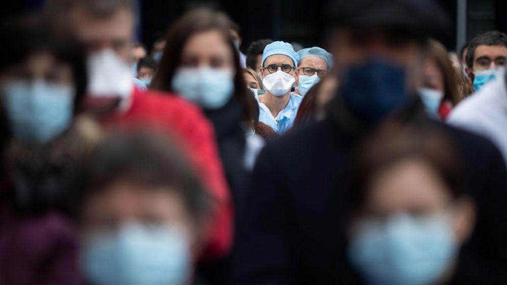 Medical staff observe a minute of silence while protesting a lack of resources outside the Strasbourg University Hospital, eastern France.
